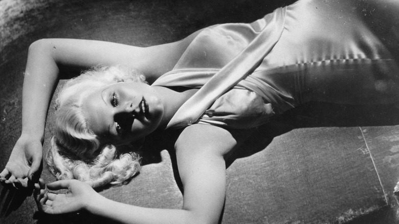 Jean Harlow reclining in dress