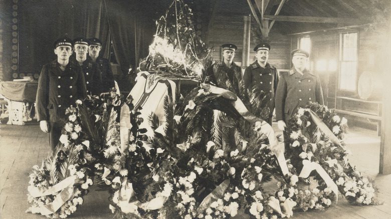 Coffin of German POW with wreaths and sailors