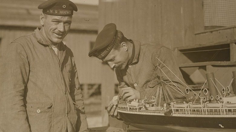 German prisoners building a miniature ship