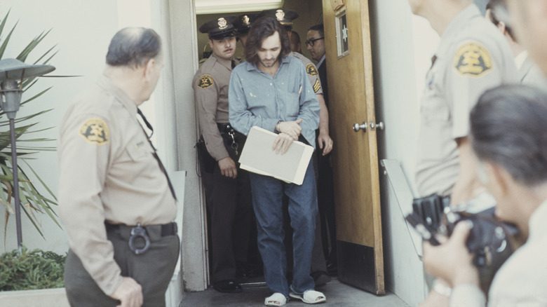 Charles Manson escorted by police