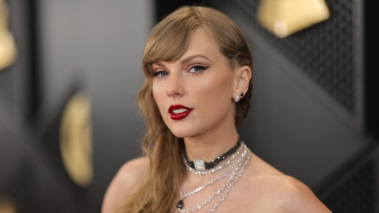 Taylor Swift red lips looking serious