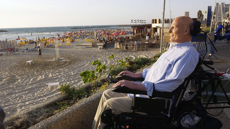 Christopher Reeve smiling wheelchair by beach