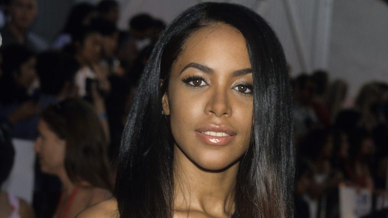 Aaliyah long dark hair smiling at event