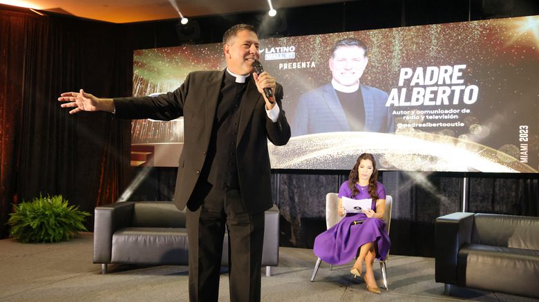 Priest Alberto Cutie speaking mic smiling