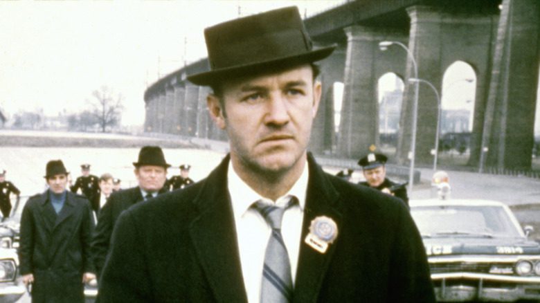 Gene Hackman suit hat bridge police background