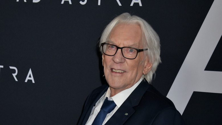 donald sutherland glasses suit smiling