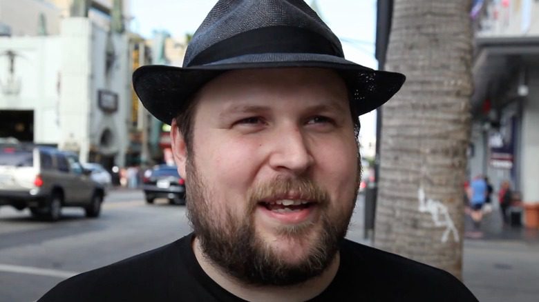 Markus Persson en chapeau fedora