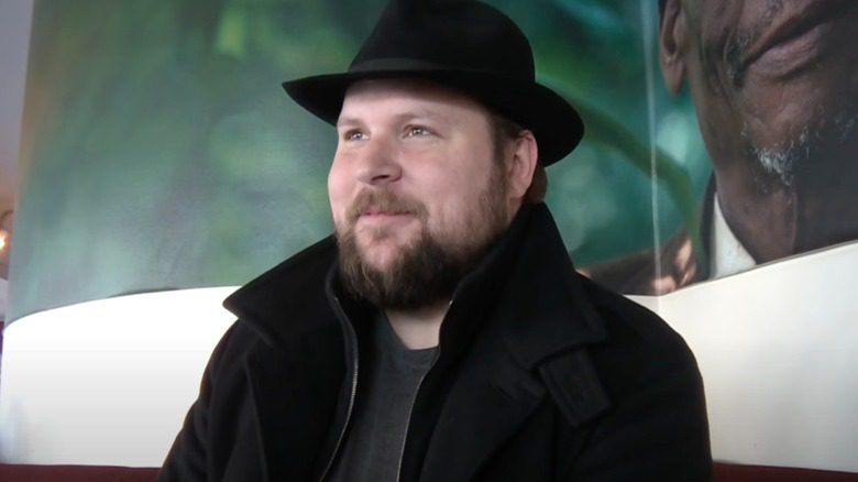 Markus Persson souriant ironiquement