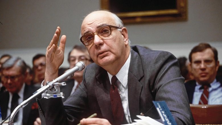 paul volcker suit speaking mic