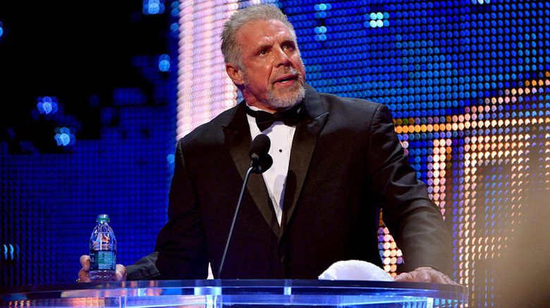 Ultimate Warrior suit bow tie speaking onstage