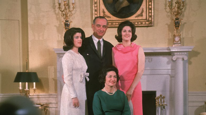 President Lyndon Johnson posing with his wife and daughters