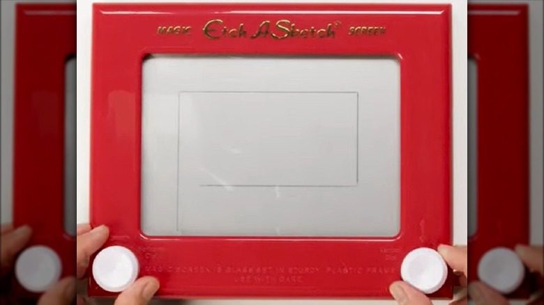 sketching on Etch A Sketch