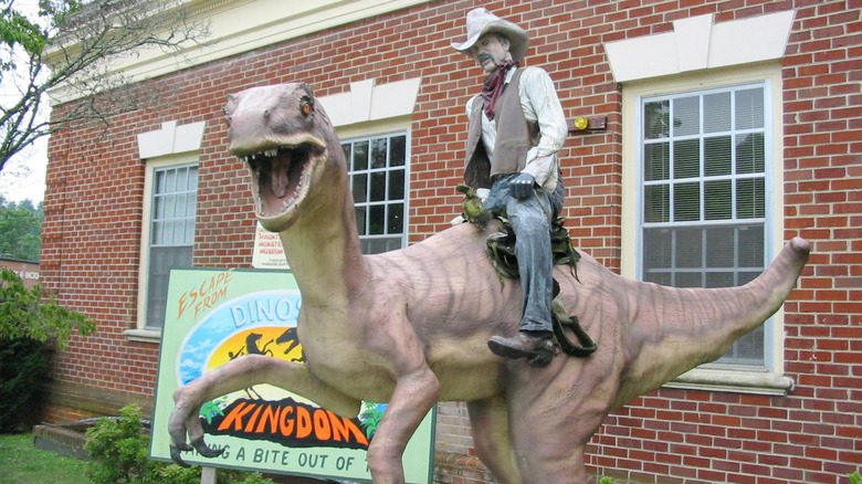 cowboy riding dinosaur at dinosaur kingdom