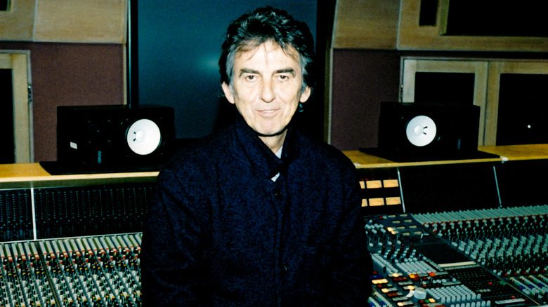 George Harrison standing in front of mixer