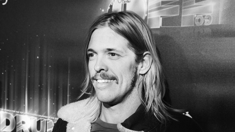 Taylor Hawkins backstage smiling mustache