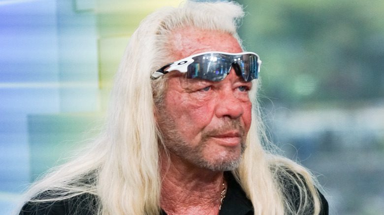 duane dog chapman sunglasses on forehead serious