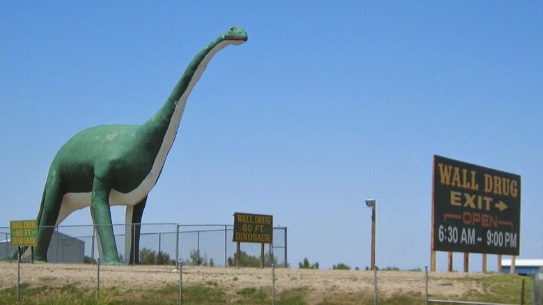 Dinosaur at Wall Drug Sign