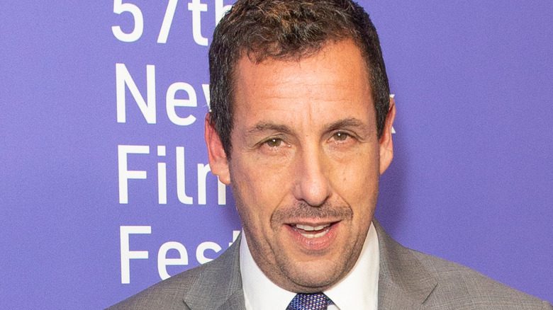 adam sandler furrowed brow mouth open suit