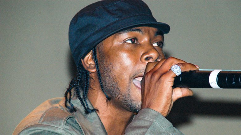 Static Major rapping into microphone