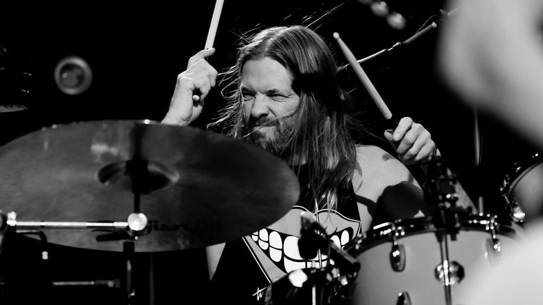 Taylor Hawkins drums onstage performing