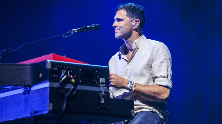 Tim Rice-Oxley seated behind keyboard onstage