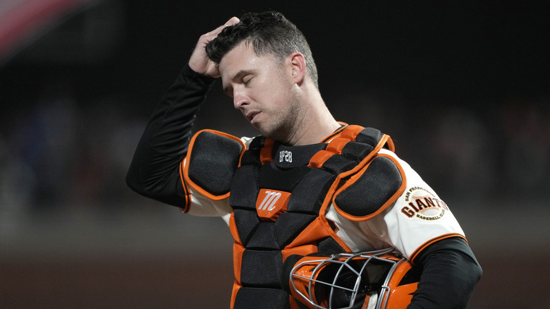 Buster Posey hangs his head