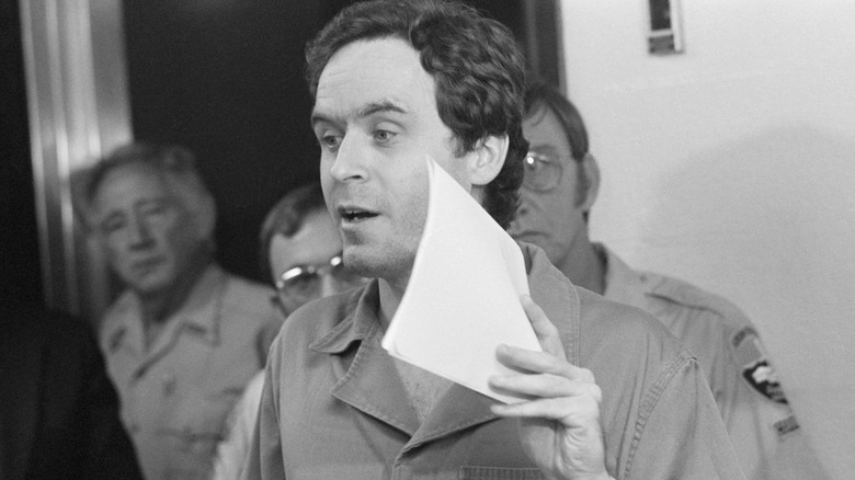 Ted Bundy holding sheet of paper