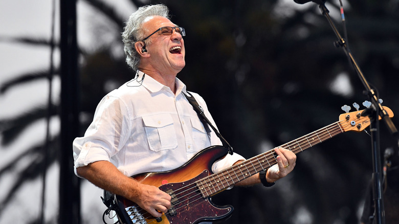 Stu Cook playing bass on stage