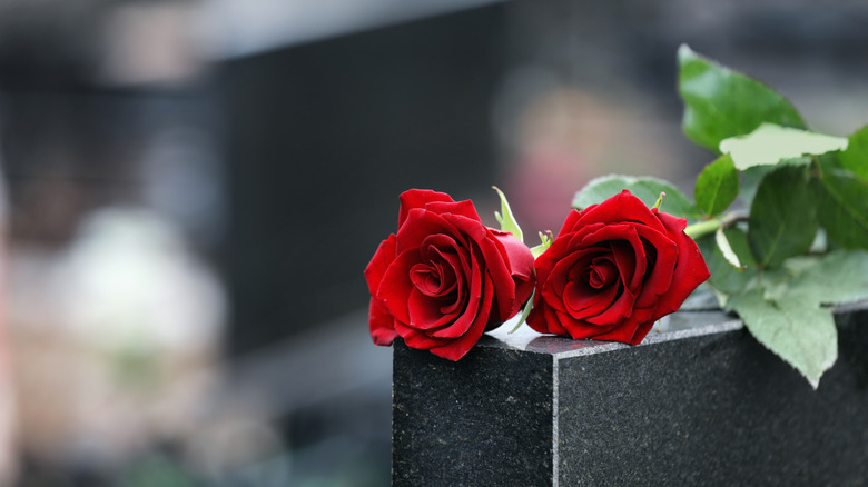 flowers on tombstone