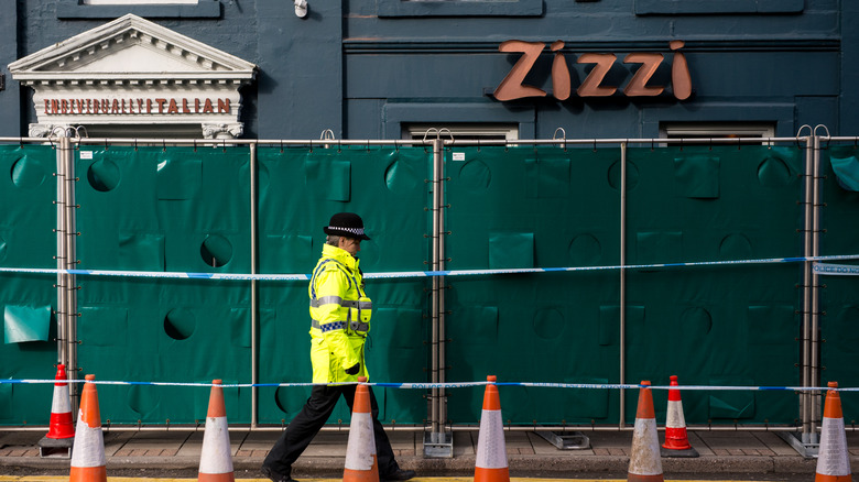 Police officer outside Zizzi restaurant