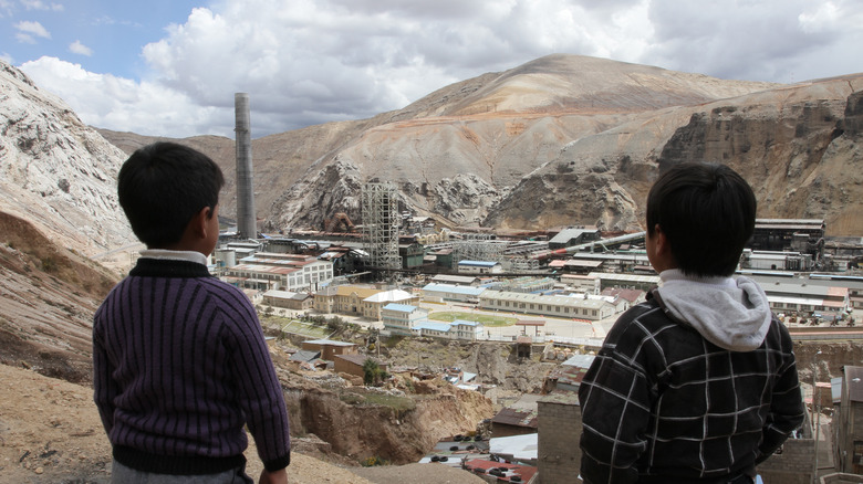 Kids looking at mining facility