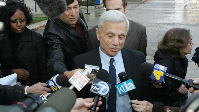 Robert Blake talking to microphones