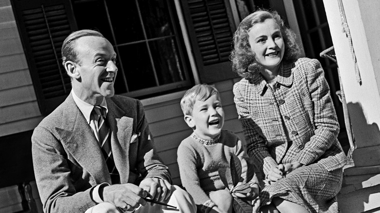 Fred Astaire, Phyllis Astaire, and their son posing for the camera