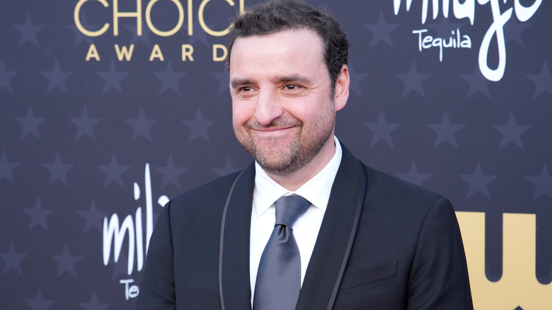 David Krumholtz wearing a suit and smiling at the Critics Choice Awards