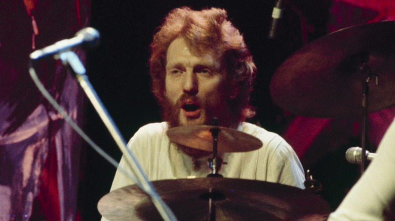 Ginger Baker playing the drums on stage in the 1970s