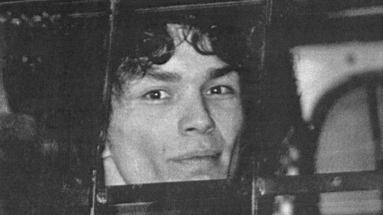 Richard Ramirez looks out of police van window