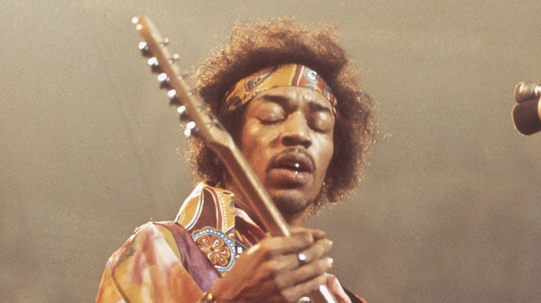 Jimi Hendrix playing guitar onstage in early 1970s