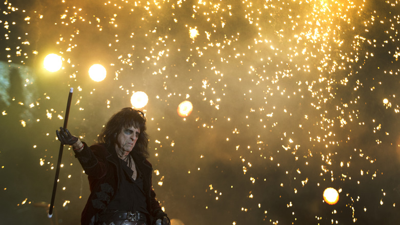 Alice Cooper twirling baton during explosion