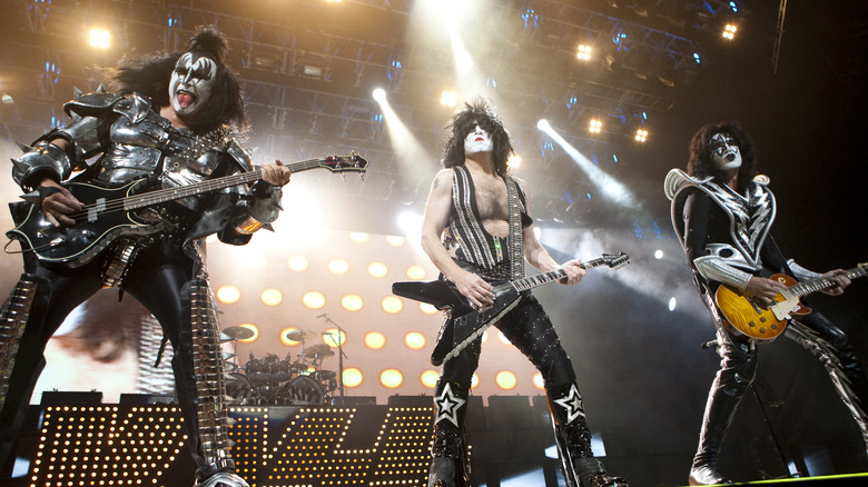 Kiss' Gene Simmons, Paul Stanley, and Tommy Thayer playing at the Rose Garden arena