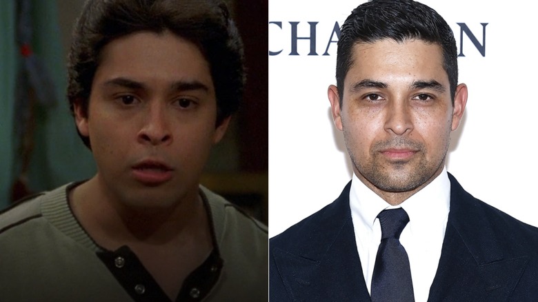 Wilmer Valderrama as Fez on That 70s Show, glaring at camera in suit 2020s