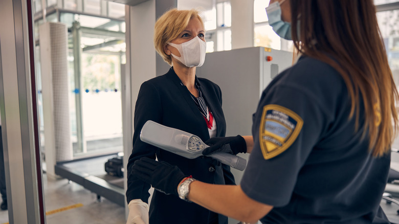 TSA using metal detecting wand