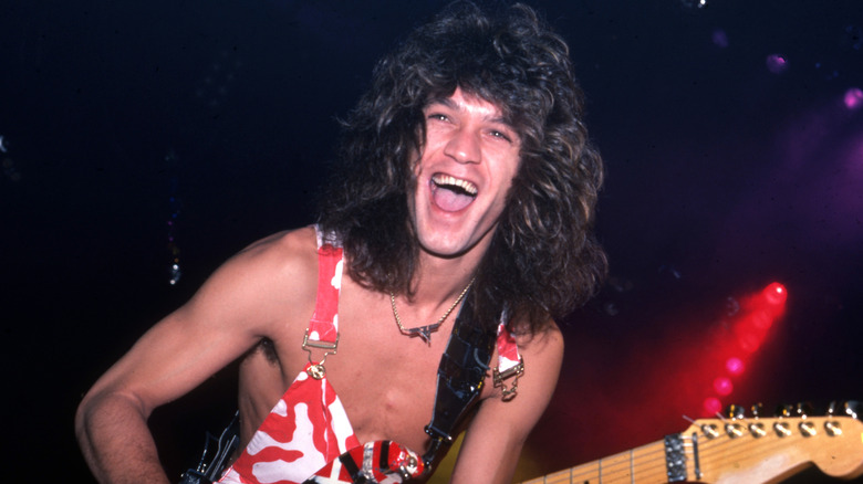 Eddie Van Halen playing guitar onstage with Van Halen