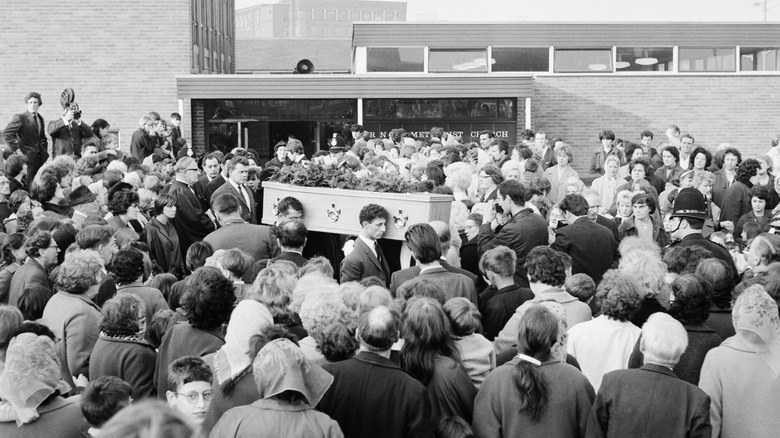 coffin and crowd