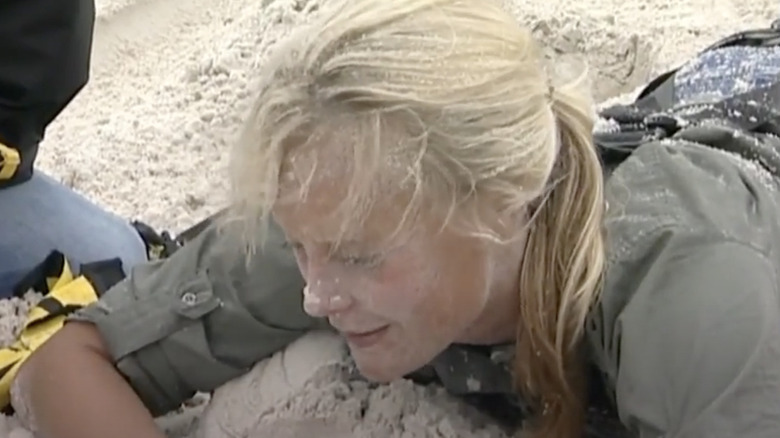 Lebo Babe on Fear Factor covered in sand